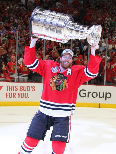 Duncan Keith Hoisting Stanley Cup